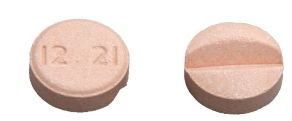 Pill 12 21 Orange Round is Carbidopa