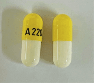 Pill A220 Yellow & White Capsule/Oblong is Nitrofurantoin (Macrocrystals)