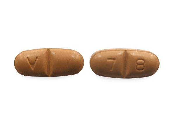 Pill V 7 8 Brown Oval is Oxcarbazepine
