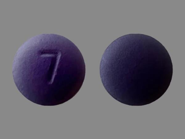 Pill 7 Purple Round is Hydroxyzine Hydrochloride