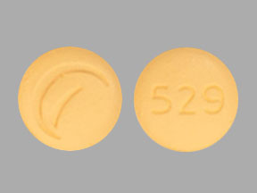 Pill 529 Logo (Actavis) Yellow Round is Donepezil Hydrochloride