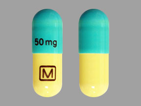 Pill M 50 mg Blue & White Capsule/Oblong is Clomipramine Hydrochloride
