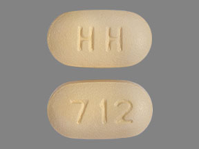 Pill HH 712 Beige Capsule/Oblong is Paroxetine Hydrochloride