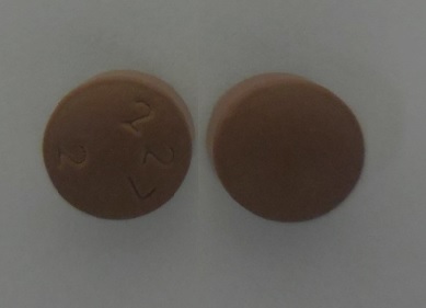 Pill 227 2 Brown Round is Paroxetine Hydrochloride Extended Release