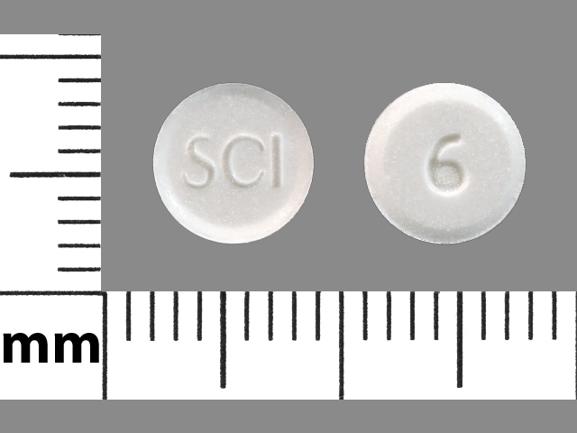 Pill SCI 6 White Round is Sodium Fluoride (Chewable)