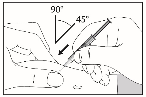 A close-up of a hand holding a syringe  Description automatically generated